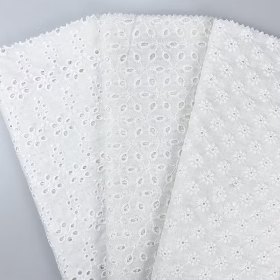 Tessuto ricamato con occhielli in voile svizzero ricamato in cotone bianco al 100% per abiti da donna